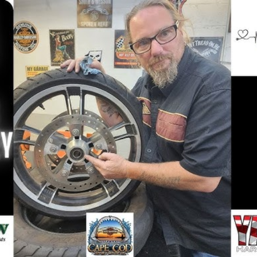 How do I install a new rear wheel bearing on my 2009 Harley-Davidson Softail Custom