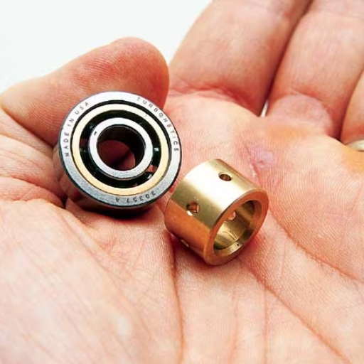 How do journal bearings compare to ball bearings in turbos