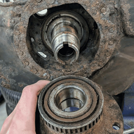 What are the dangers of driving with a damaged wheel bearing
