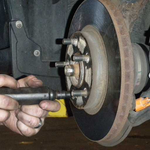 What are the steps to reassemble the wheel after bearing replacement