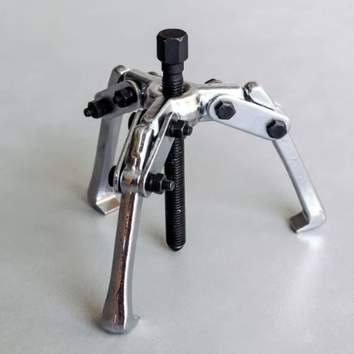 What are the steps to remove a wheel bearing using an extractor tool