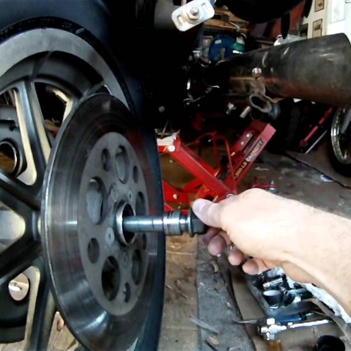 What maintenance is required for the rear wheel bearing on a 2009 FXSTC