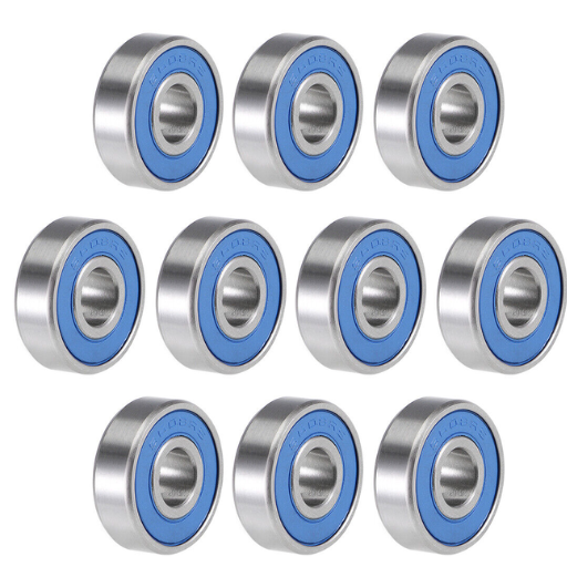What are the main differences between ball bearings and journal bearings