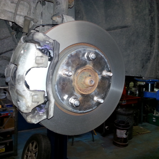 What are the most common signs of a failing rear wheel bearing